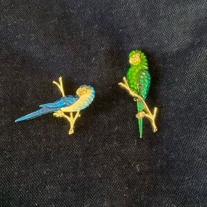 2 enamel parrots pins 1 emerald green 1 sapphire blue color silver toned branch
